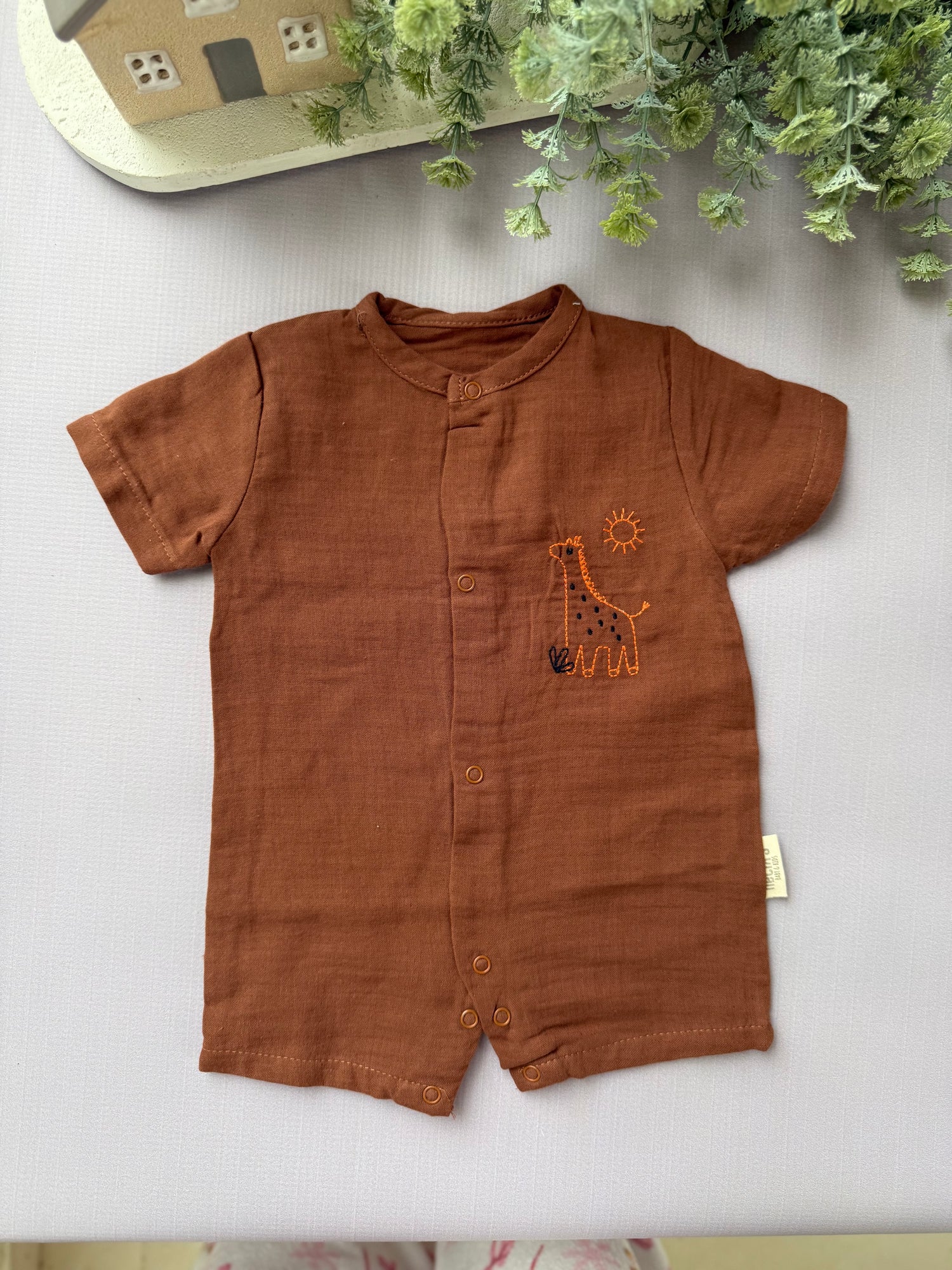 Brown dino romper